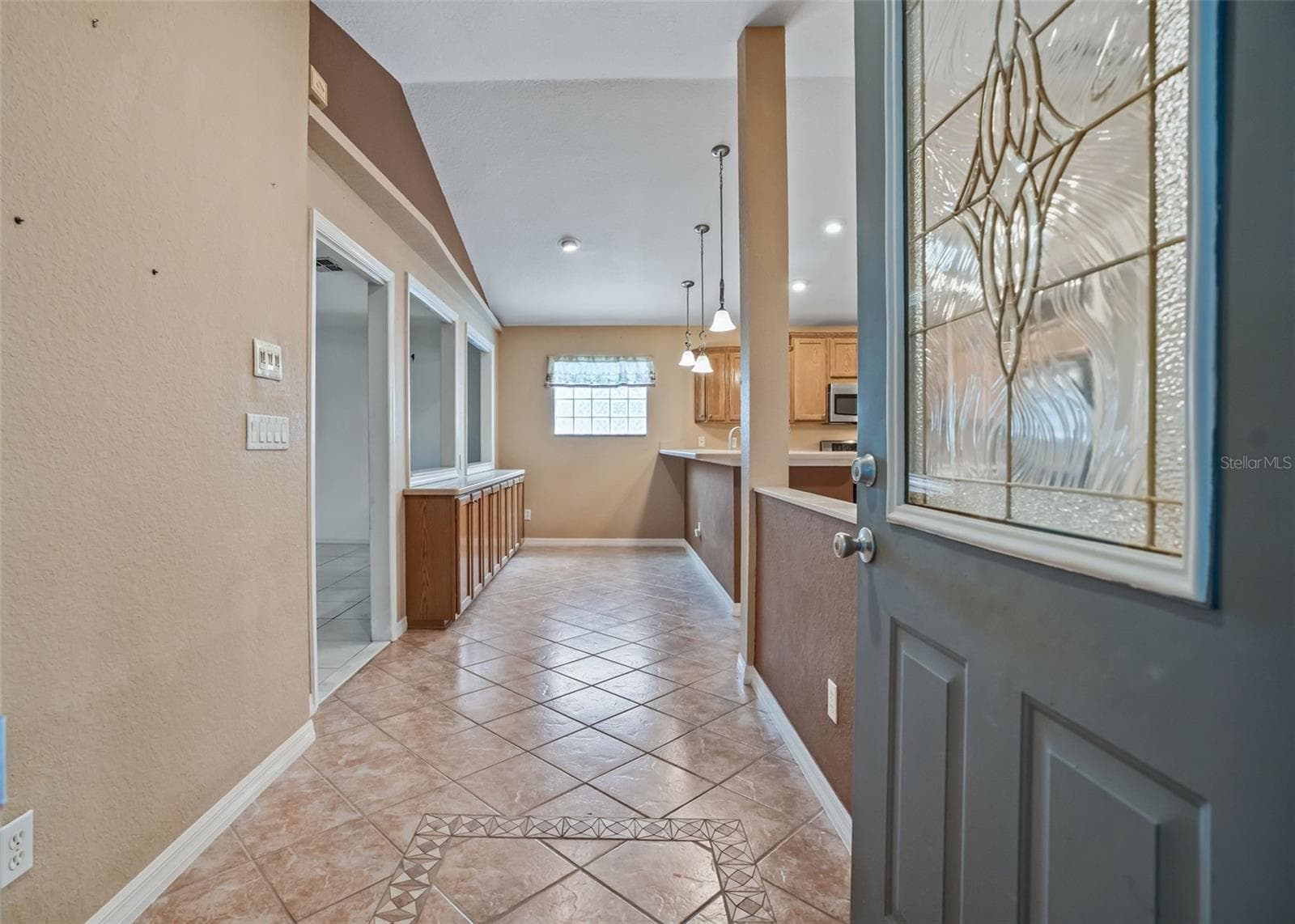 Main door w/Elegant leaded glass door w/sidelight accent - 17681 SE 115TH CT, SUMMERFIELD