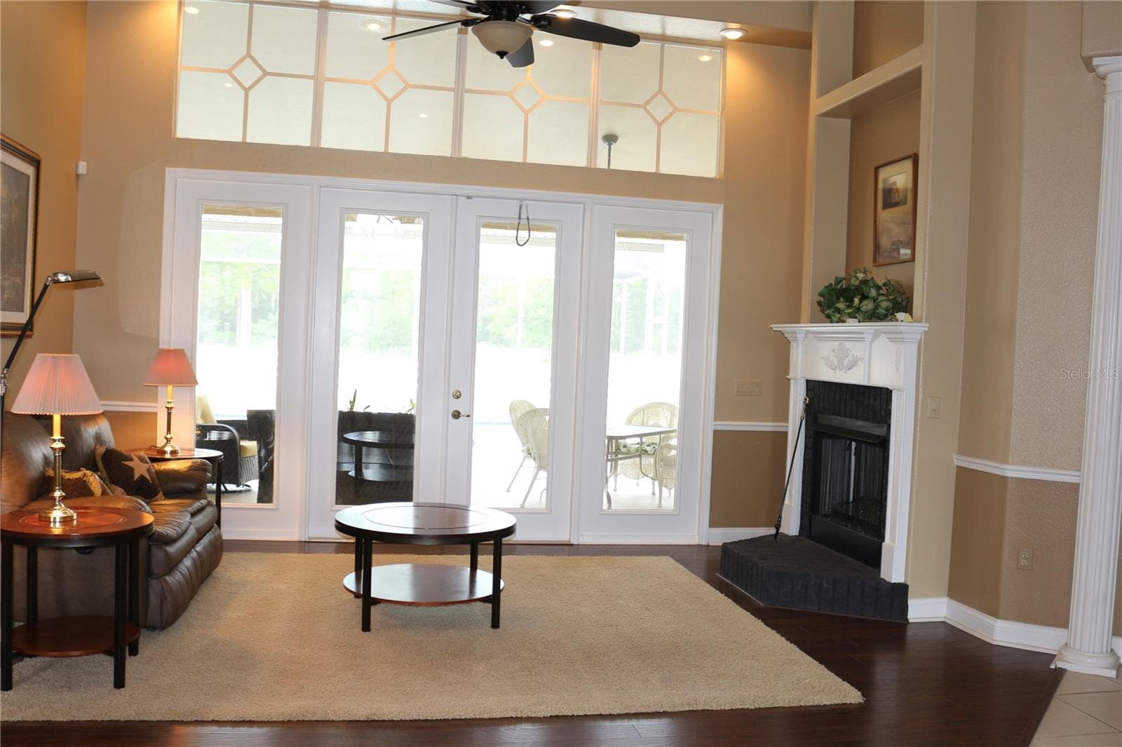 Expansive windows and doors to the lanai and pool area. - 6722 W SENTINEL BLUFF PATH, BEVERLY HILLS