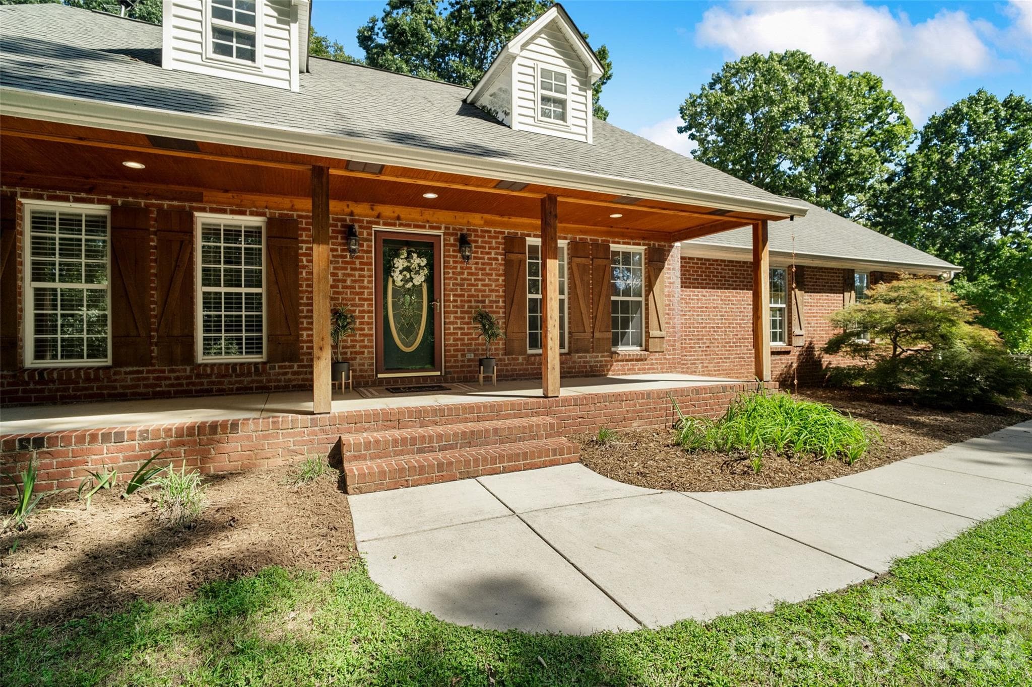 Front porch with cedar posts, trim and beadboard. - 996 Beamguard Road, Clover