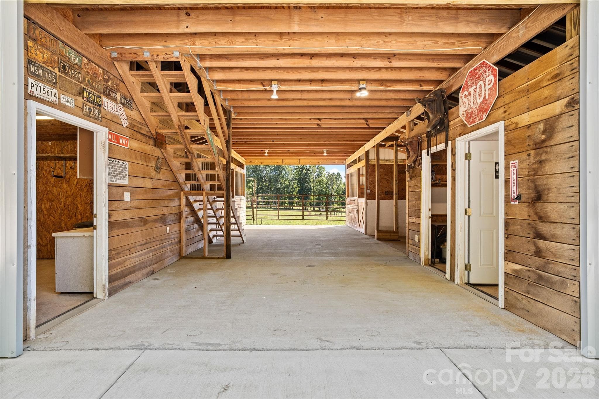 3 Stall Barn with tack room, hot/cold wash rack, 1/2 bath, feed room and hay loft. [41ft x 34ft] - 996 Beamguard Road, Clover
