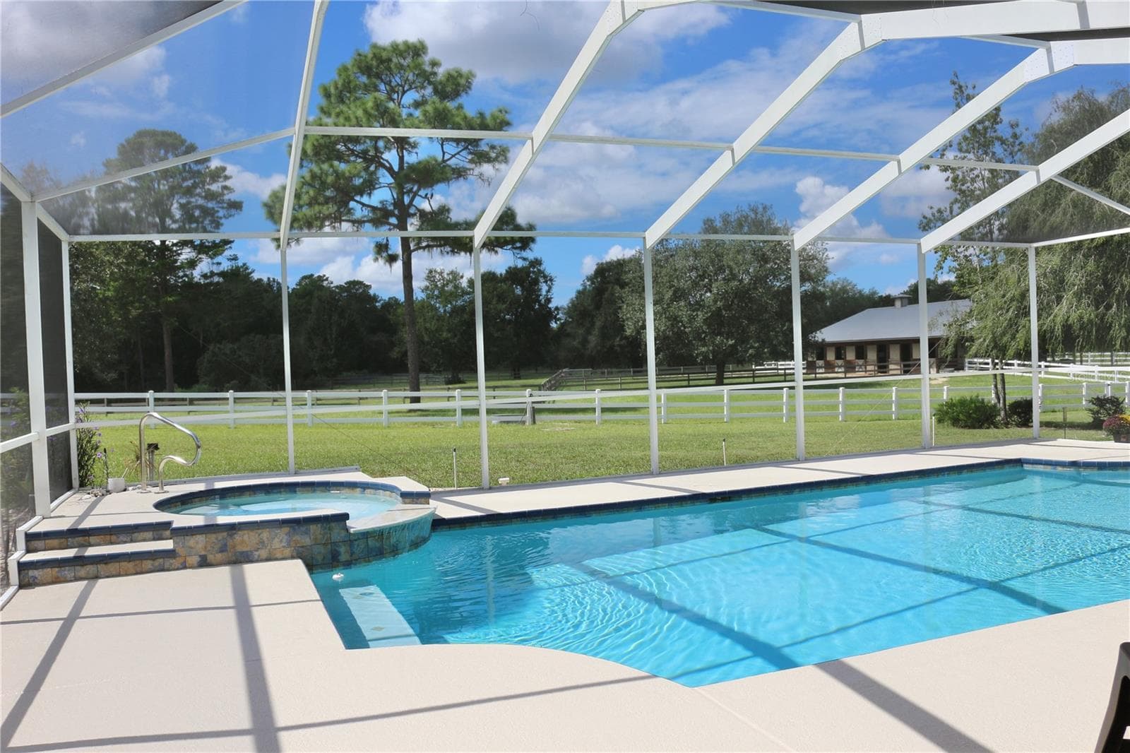 Screen enclosed pool overlooks the beautiful acreage and pastures - 6722 W SENTINEL BLUFF PATH, BEVERLY HILLS