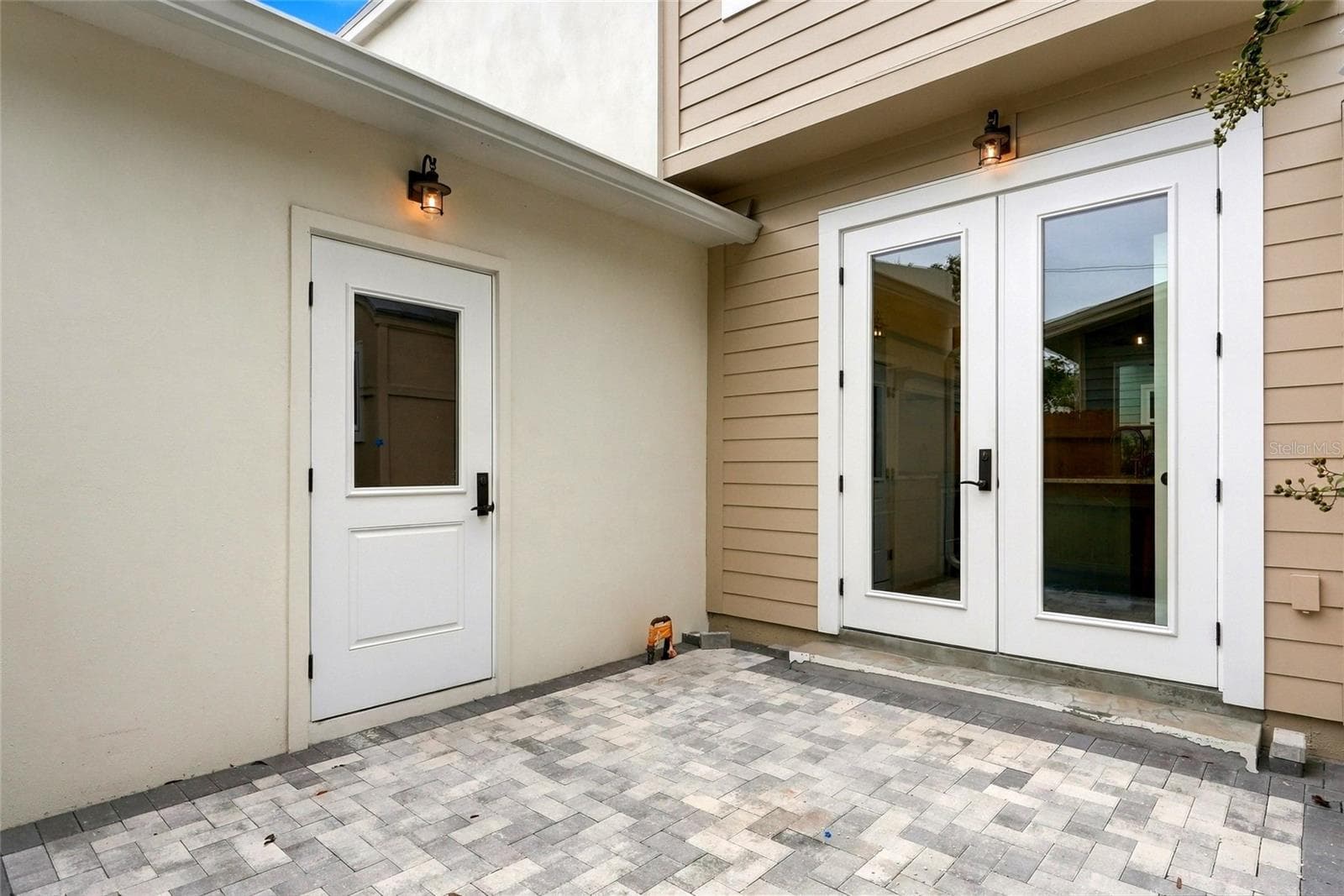 1st Floor Private Patio with Garage Access and Double Doors to Kitchen - 2534 1ST AVE N, ST PETERSBURG