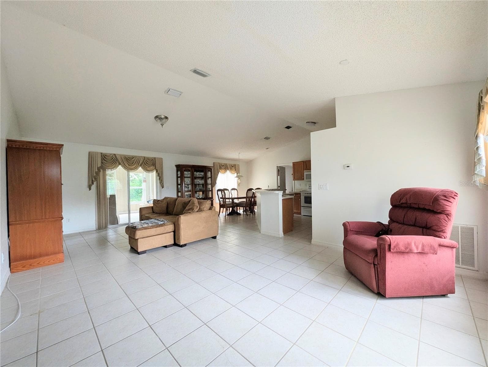 Sitting area into the open family room floorplan - 7170 ACKERMAN AVE, COCOA