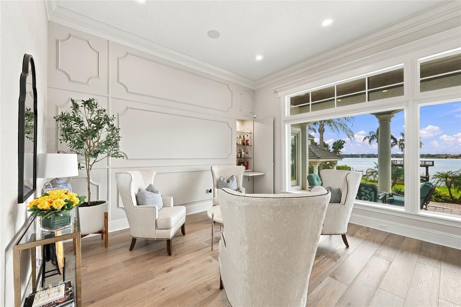 FORMAL SITTING AREA WITH HIDDEN BAR - 9602 MAYWOOD DR, WINDERMERE