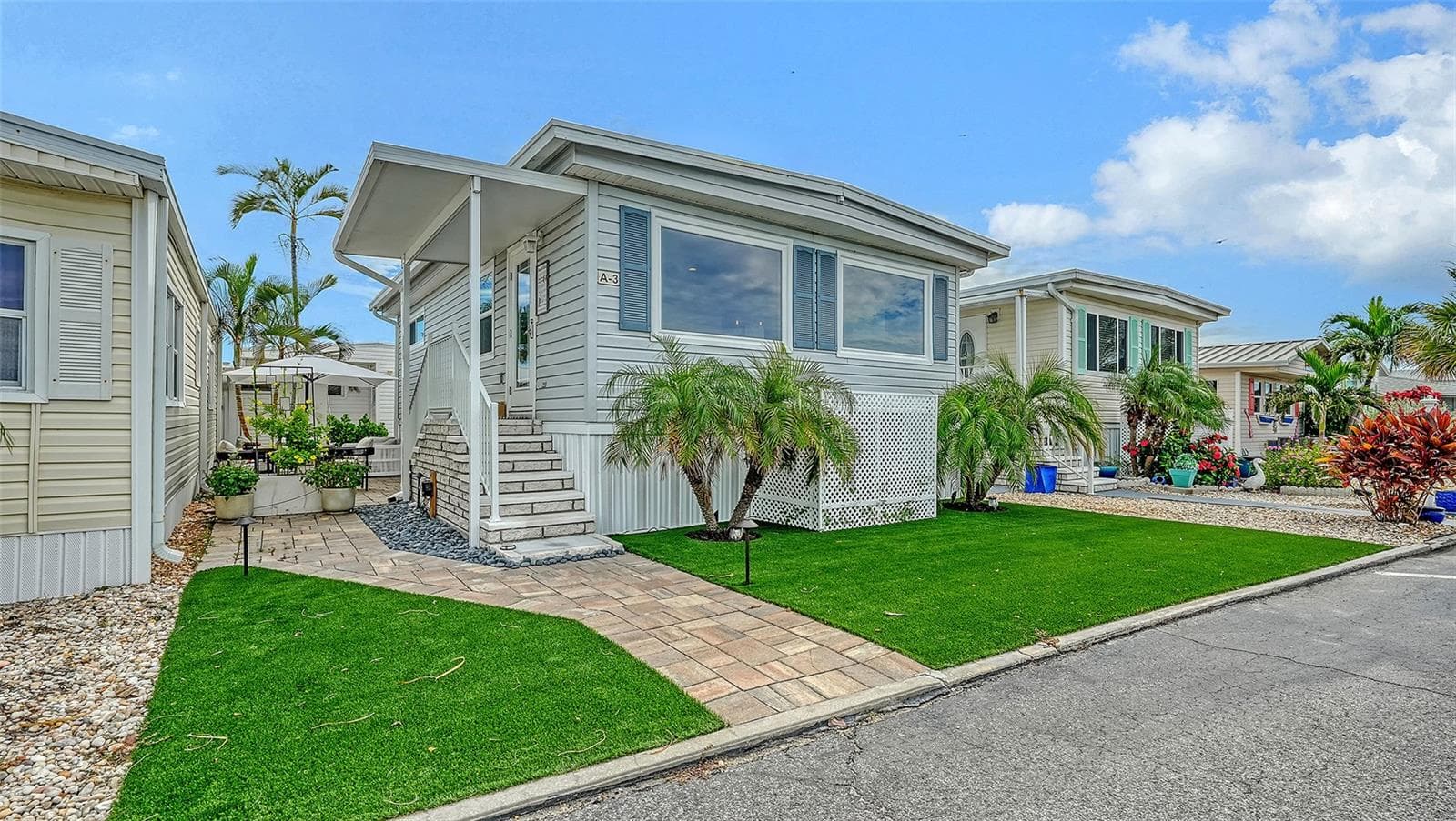 New Turf Grass and outdoor patio to the left - 3710 GULF OF MEXICO DR #A3, LONGBOAT KEY