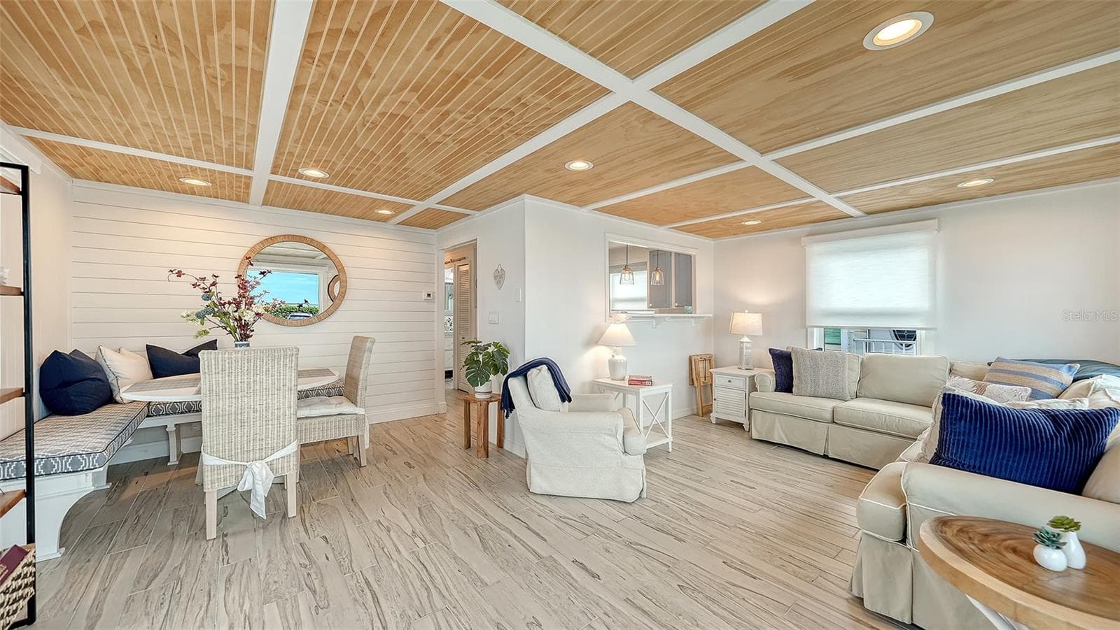 Dining area and living room with kitchen behind the opening/wall - 3710 GULF OF MEXICO DR #A3, LONGBOAT KEY