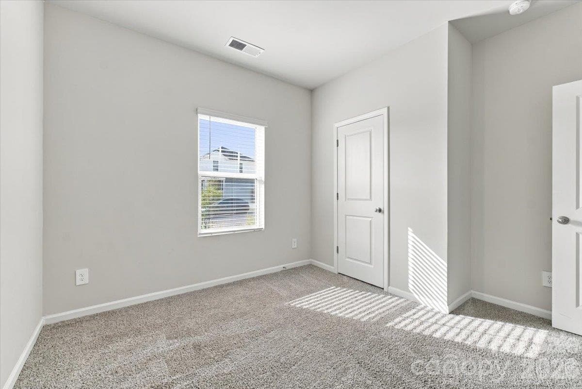 Bed 2 with jack-n-jill bath.  Natural light is plentiful - 151 Bird Dog Drive, Mooresville