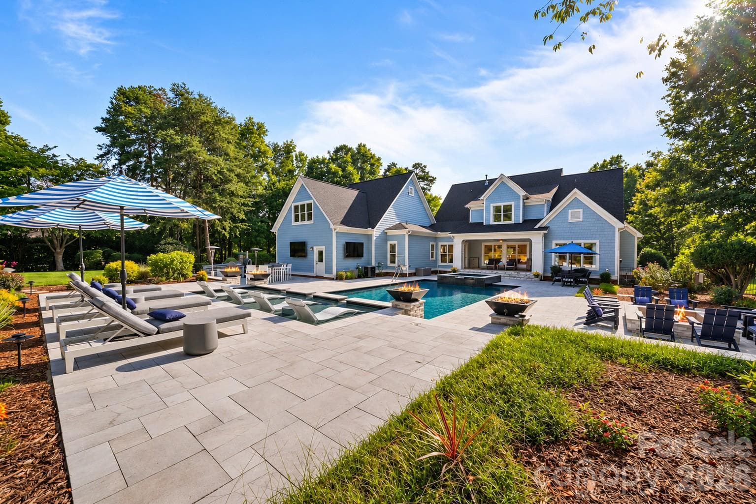 Heated saltwater pool/spa, expansive tanning deck, waterfalls, firepit, and outdoor kitchen. - 268 Milford Circle, Mooresville
