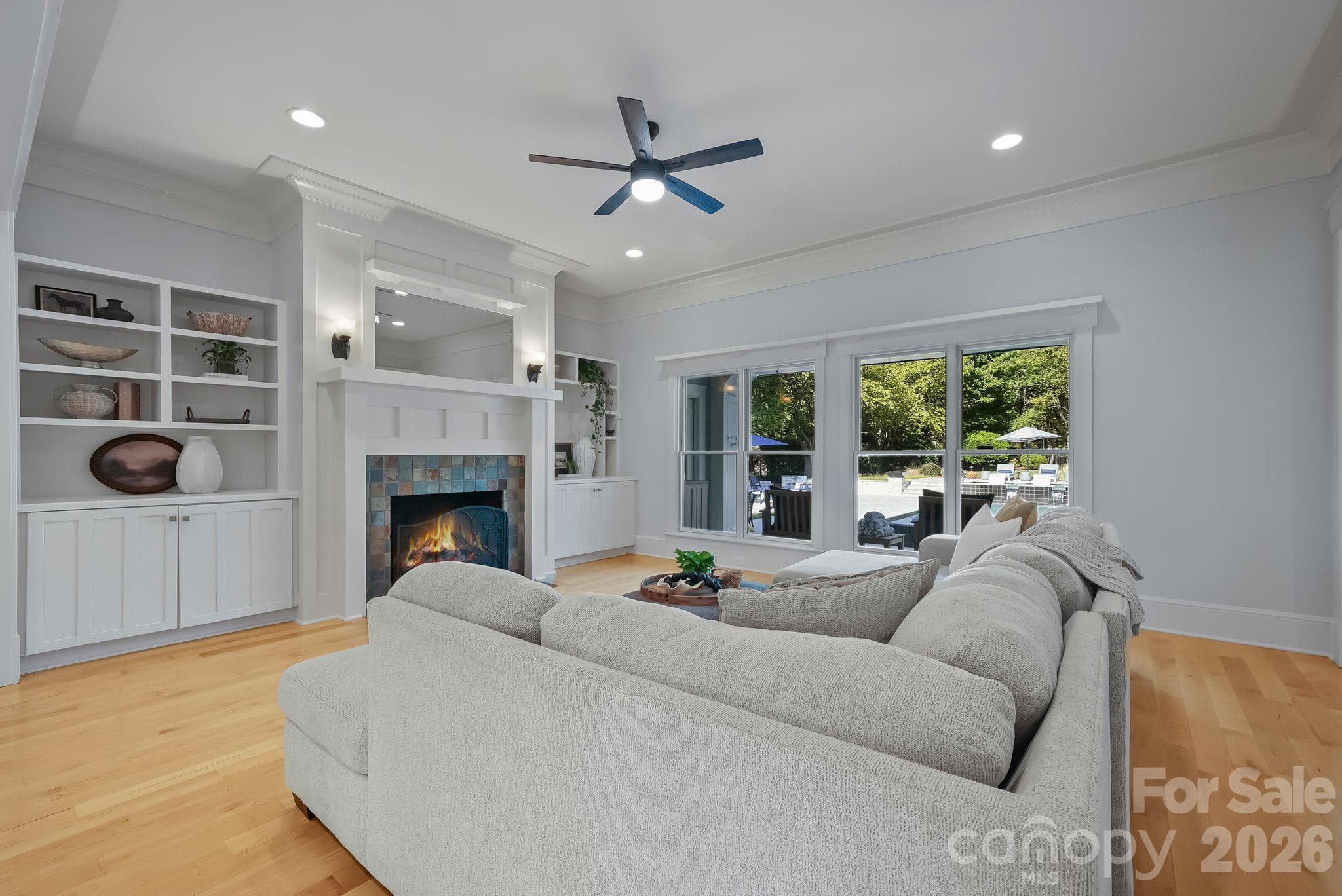 Warm and inviting living room with fireplace and custom built ins - 268 Milford Circle, Mooresville
