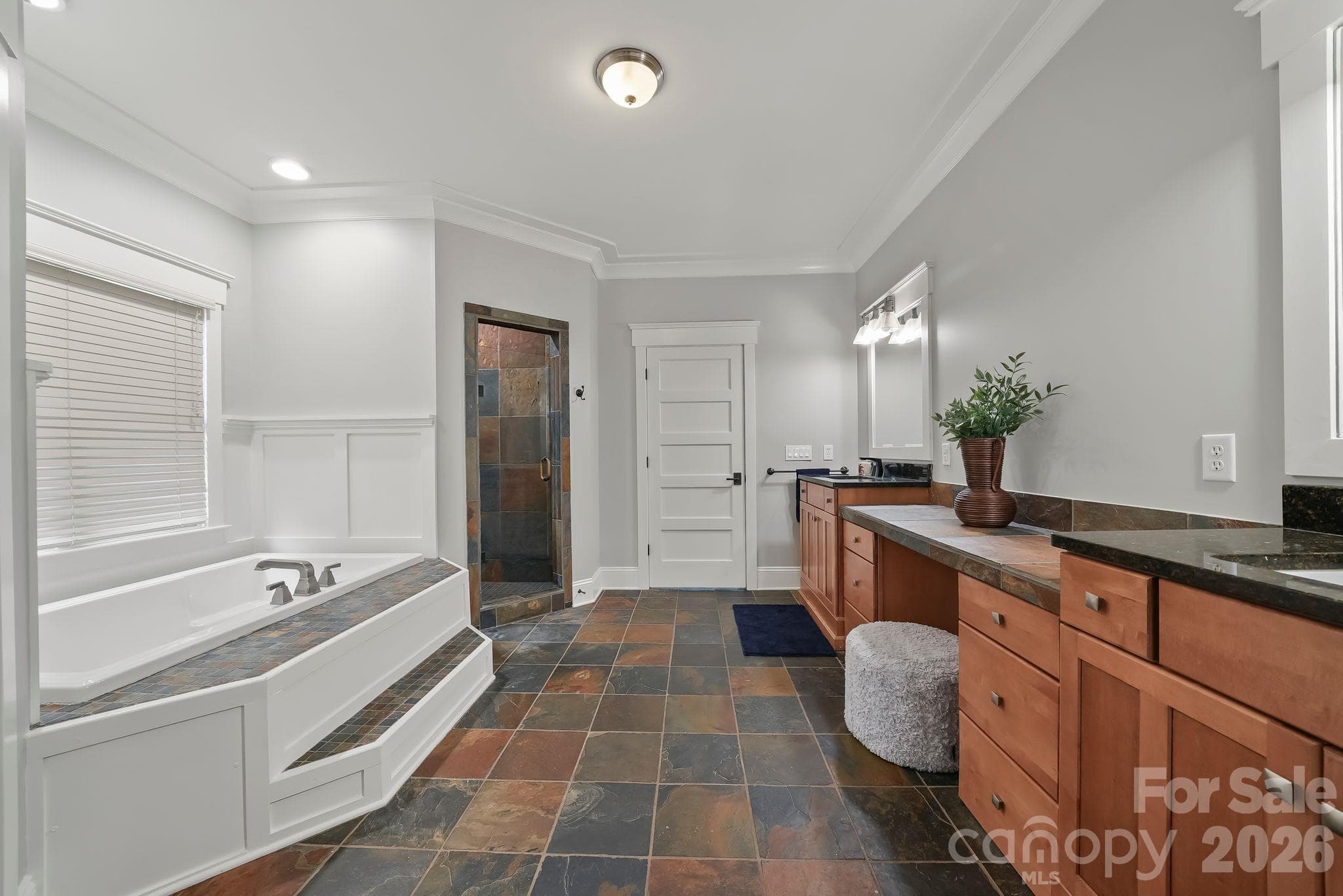 Primary bathroom with dual vanities, walk-in shower, and bathtub - 268 Milford Circle, Mooresville