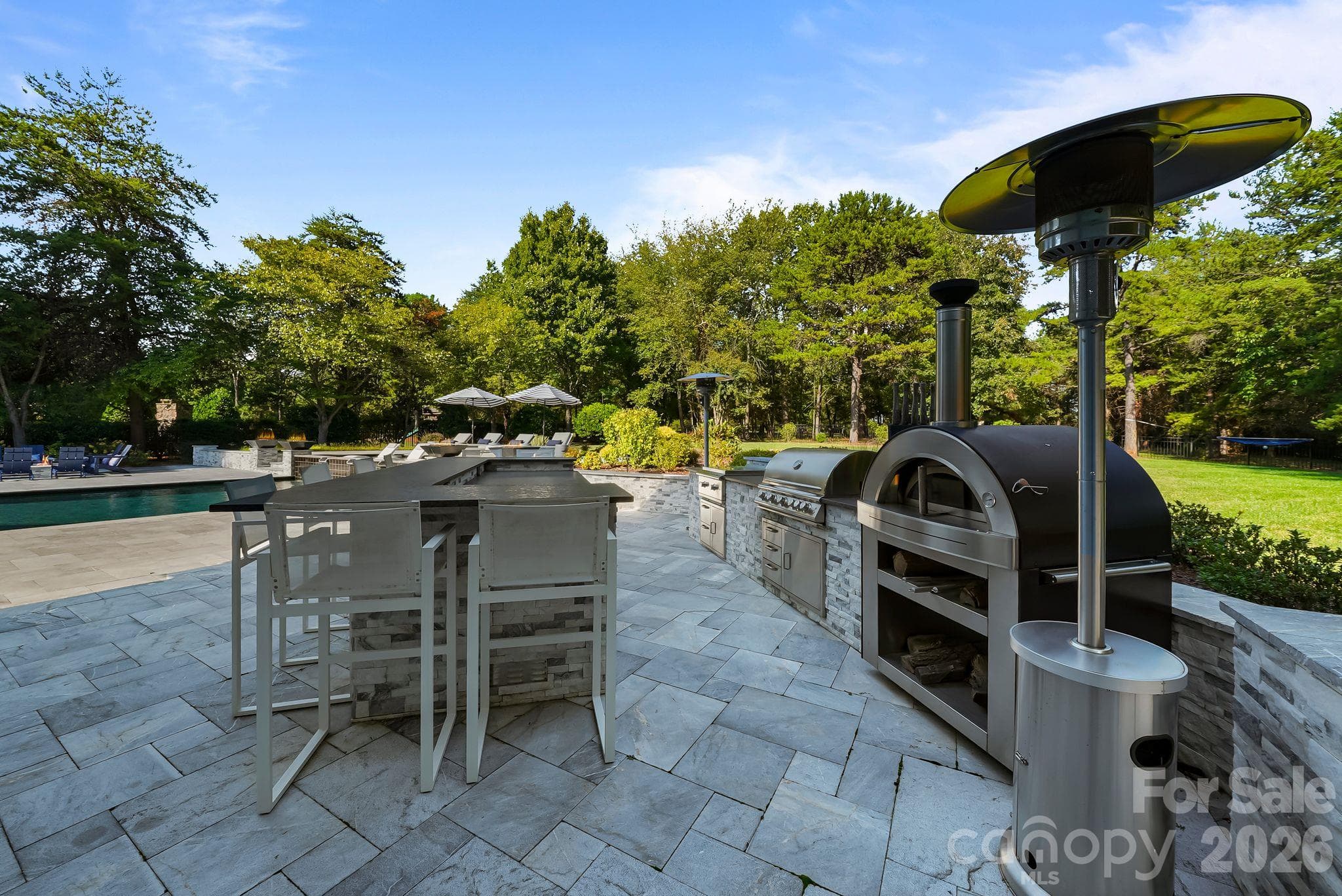 Outdoor kitchen features, built in gas grill, cooktop, and mini refrigerator - 268 Milford Circle, Mooresville