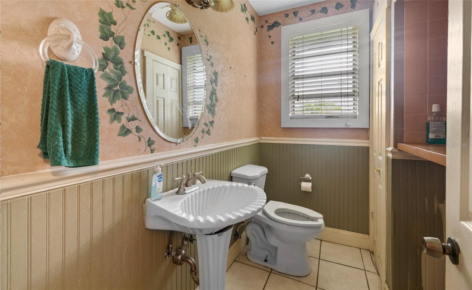 Guest restroom. It doesnt show where the shower used to be which is kind of behind the door - 8602 N ROME AVE, TAMPA