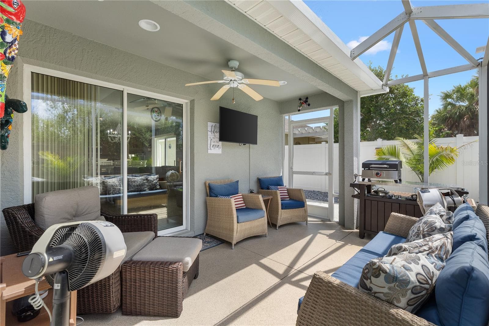 Covered TV on Lanai with extended screen. - 780 ADRIENNE WAY, THE VILLAGES