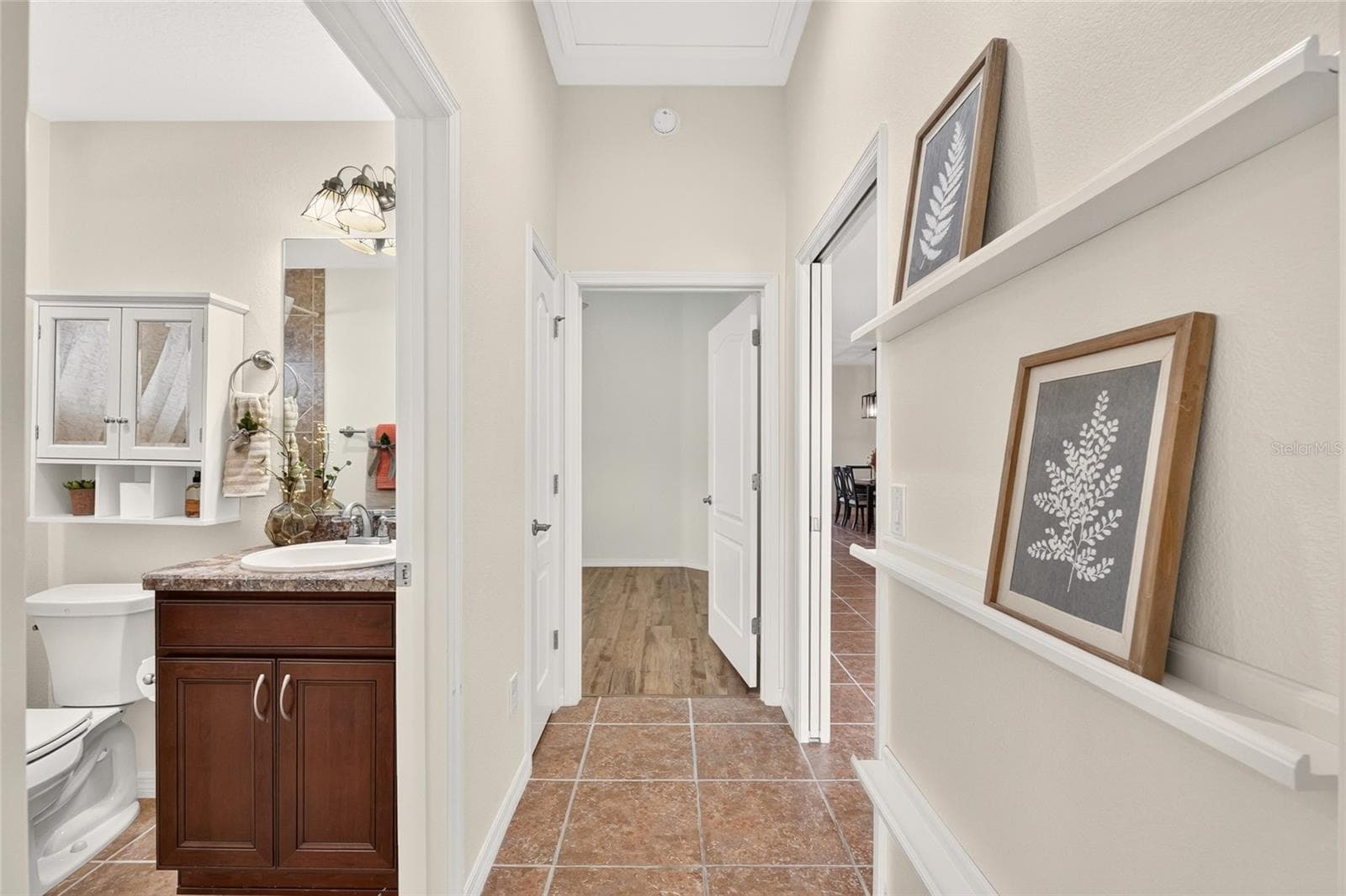 A pocket door separates the GUEST WING from the main living area, offering added privacy with convenient access to the guest bath. - 2454 MORNING DOVE LN, THE VILLAGES