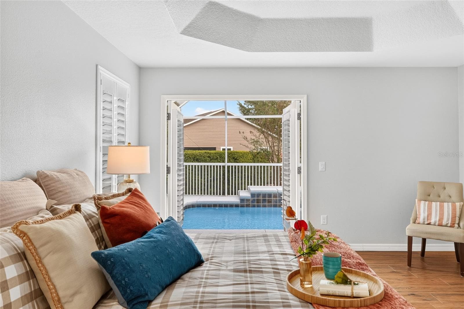 Wake up to sparkling POOL VIEWS and step through the PRIMARY SUITE’S French doors for a refreshing morning dip in your own backyard retreat! - 2454 MORNING DOVE LN, THE VILLAGES