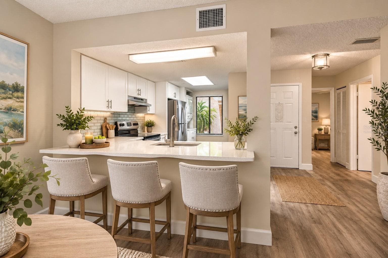 Kitchen and Foyer - Virtually staged - 7500 40TH AVE W #105, BRADENTON