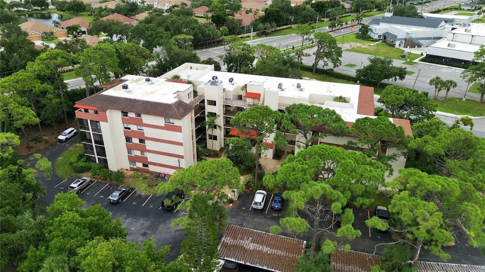 Exterior aerial view of the front of the building. - 7500 40TH AVE W #105, BRADENTON