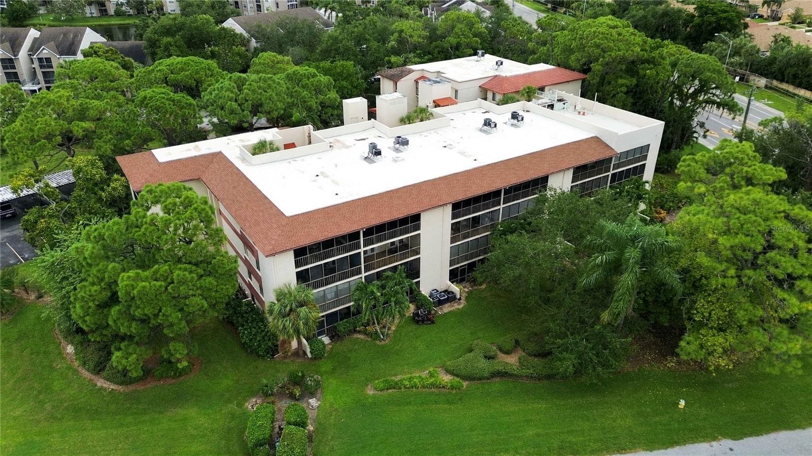 Exterior aerial view of the back of the building. - 7500 40TH AVE W #105, BRADENTON