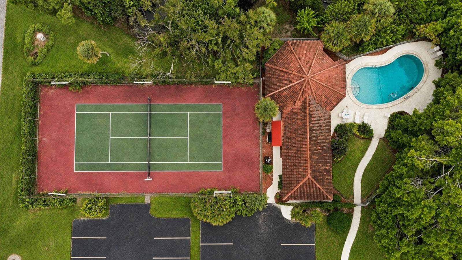 Aerial view of Tennis Court, Pool, and Clubhouse - 7500 40TH AVE W #105, BRADENTON