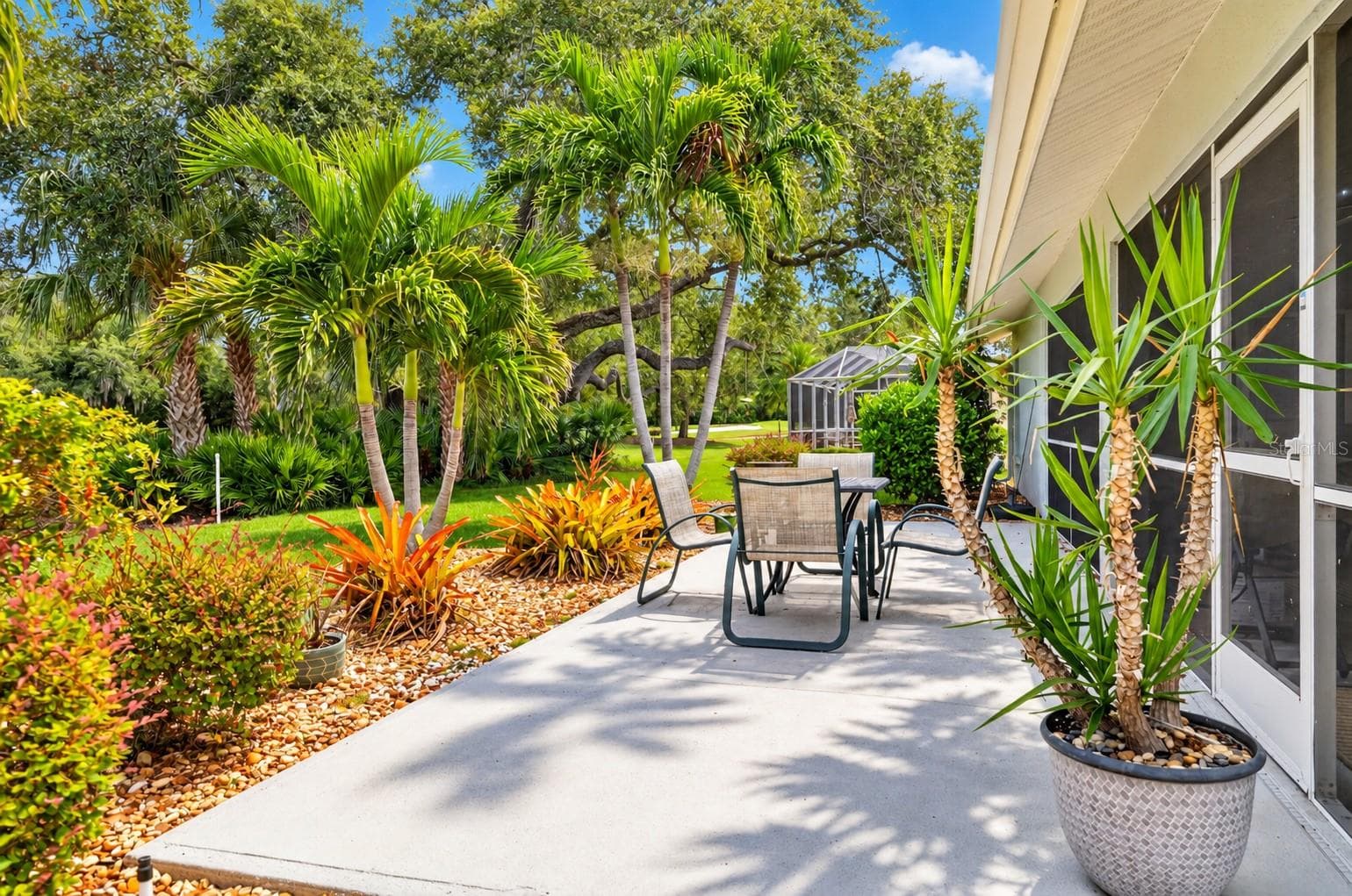 PATIO OUTSIDE OF THE SCREEN ENCLOSED LANAI - 6905 STONE RIVER, BRADENTON