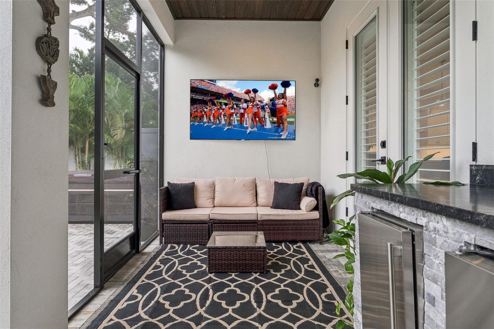 back porch (virtually staged TV) - 3513 W TACON ST, TAMPA