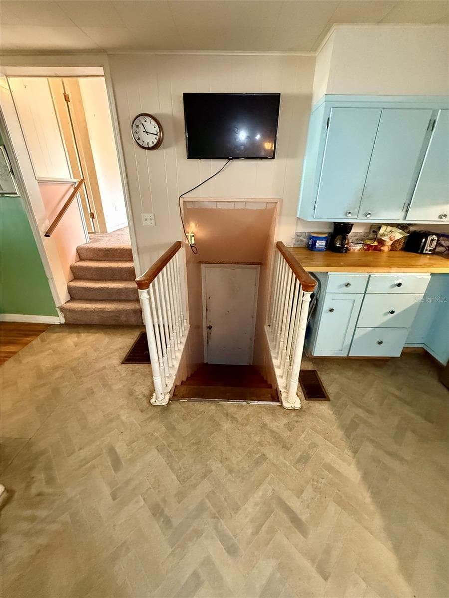 kitchen, steps up to Bonus room and bathroom - 104 13TH ST SE, WINTER HAVEN