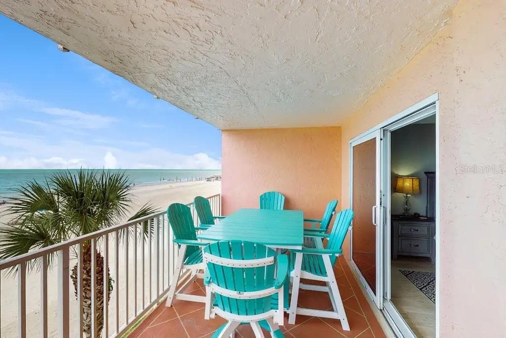 PRIVATE BALCONY OVERLOOKING THE BEACH, OFFERS DIRECT ACCESS FROM THE GREAT ROOM AND PRIMARY BEDROOM. - 18400 GULF BLVD #1208, INDIAN SHORES