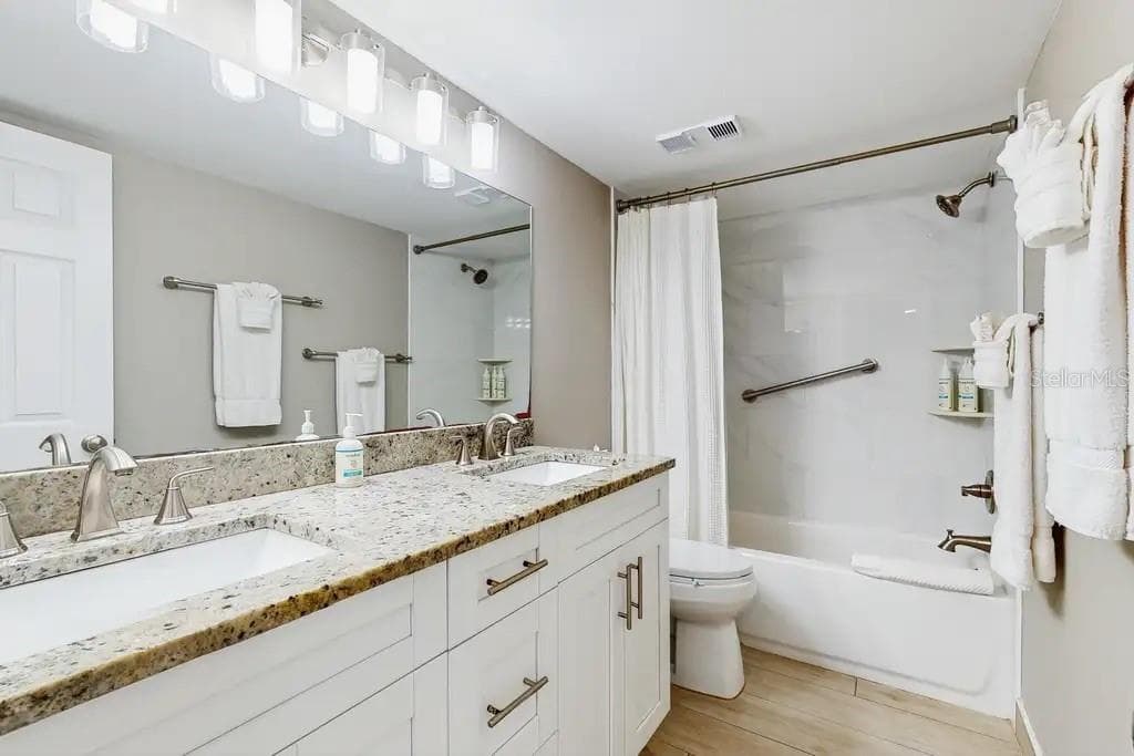 2ND BATHROOM HAS BEEN COMPLETELY REMODELED AND FEATURES A FULL TUB. - 18400 GULF BLVD #1208, INDIAN SHORES
