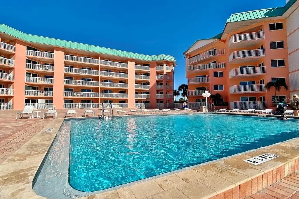 HEATED POOL ON THE SECOND FLOOR POOL DECK, ONE OF THE MANY UNIQUE AMENITIES OF THIS MID RISE COMMUNITY. - 18400 GULF BLVD #1208, INDIAN SHORES