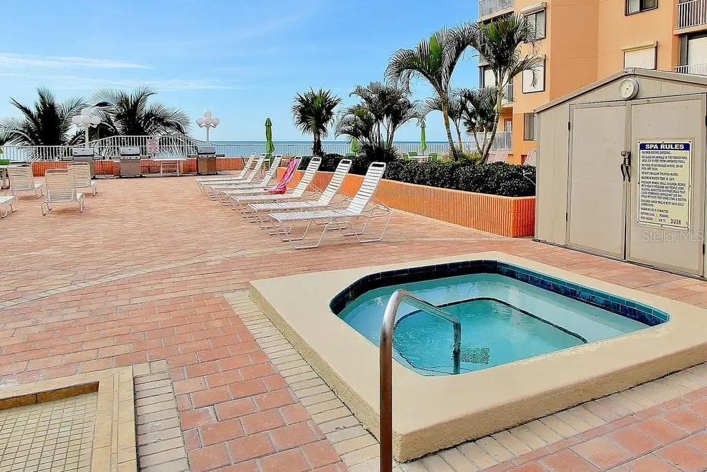 A HEATED SPA FOR ADDITIONAL RELAXATION DURING THE DAY, OR UNDER THE STARS. - 18400 GULF BLVD #1208, INDIAN SHORES