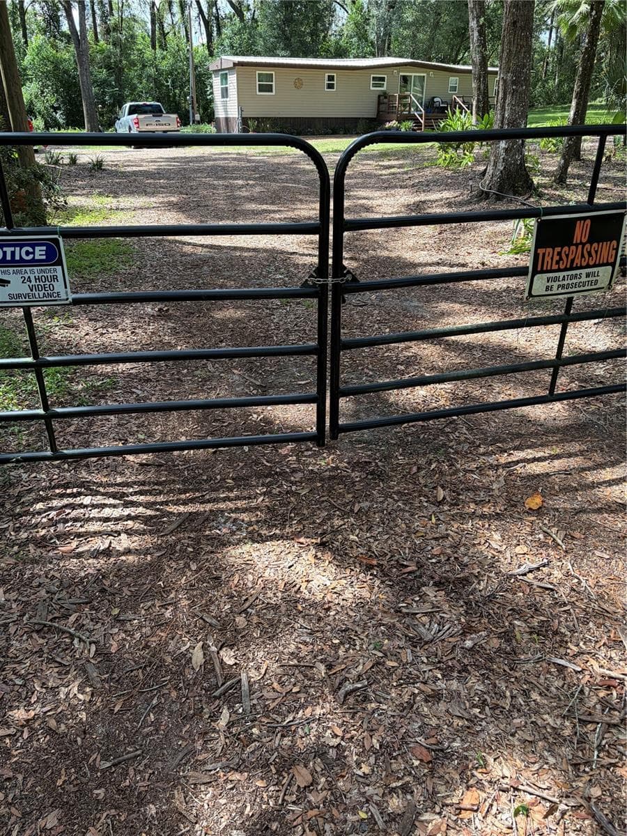 Main gate. Another one toward the back - 6401 SUNNYSIDE RANCH RD, BROOKSVILLE