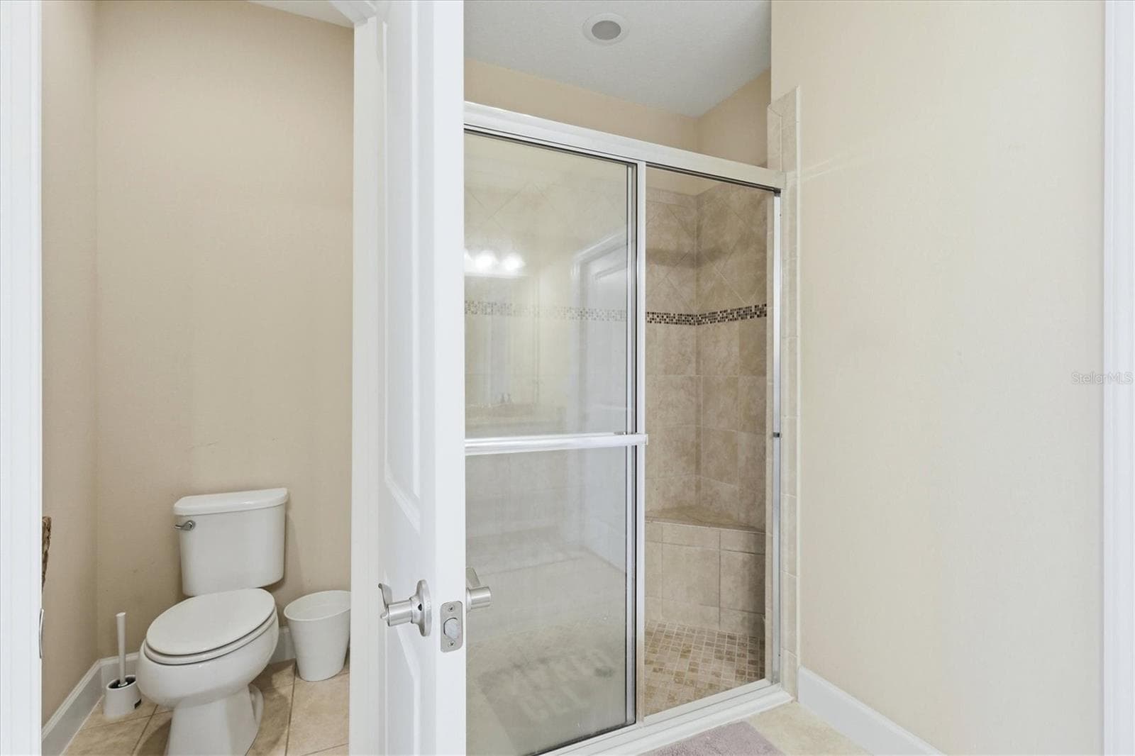 Pirmary en-suite walk-in glass enclosed shower - 4705 STAFFORD CT, PALMETTO