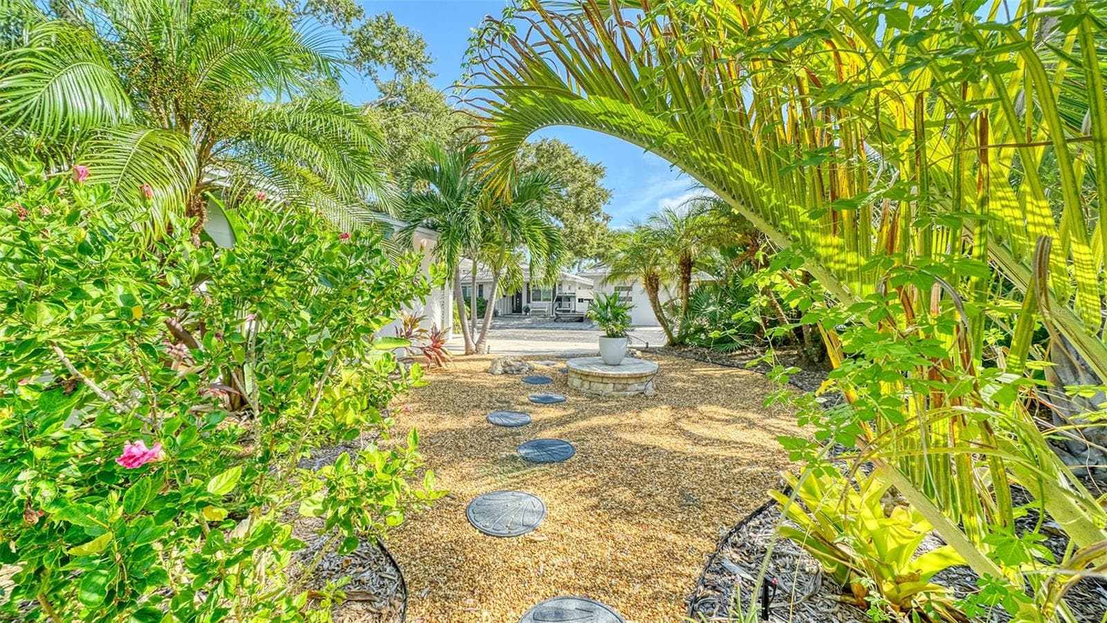 Your Private Path through Lush Landscaping to your Fire Pit - 1229 MOONMIST CIR #P6, SARASOTA