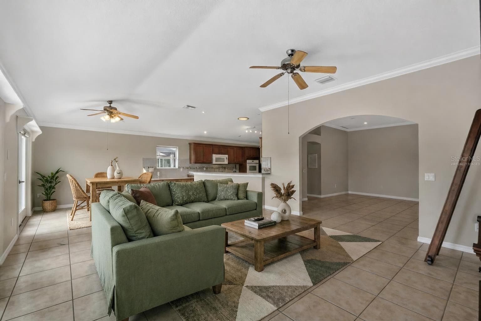 Kitchen, Dinette, and Living Room-Virtually Staged - 2334 AMBLER CIR, THE VILLAGES