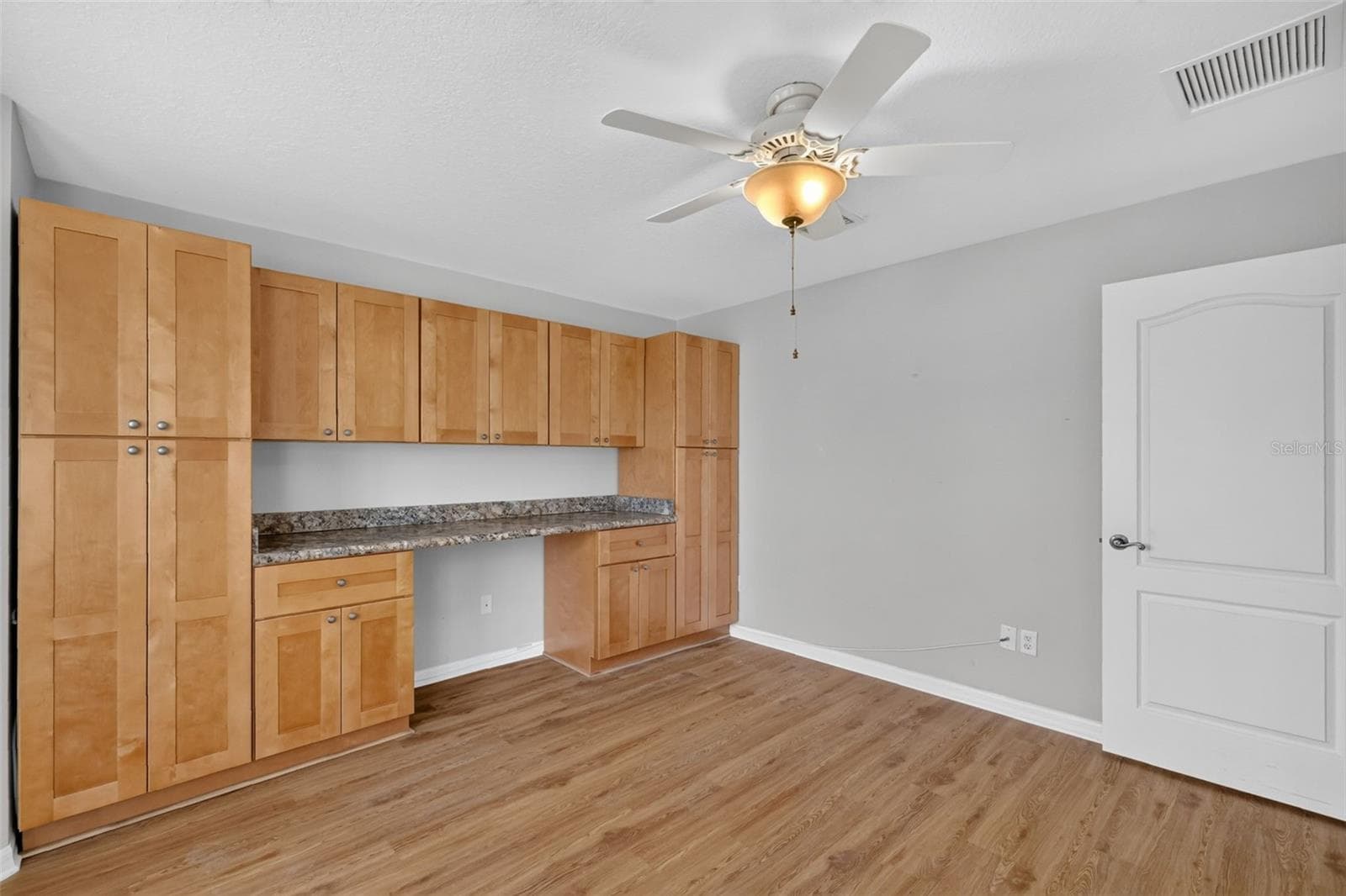 Second Bedroom with Custom Desk and Cabinetry - 2334 AMBLER CIR, THE VILLAGES