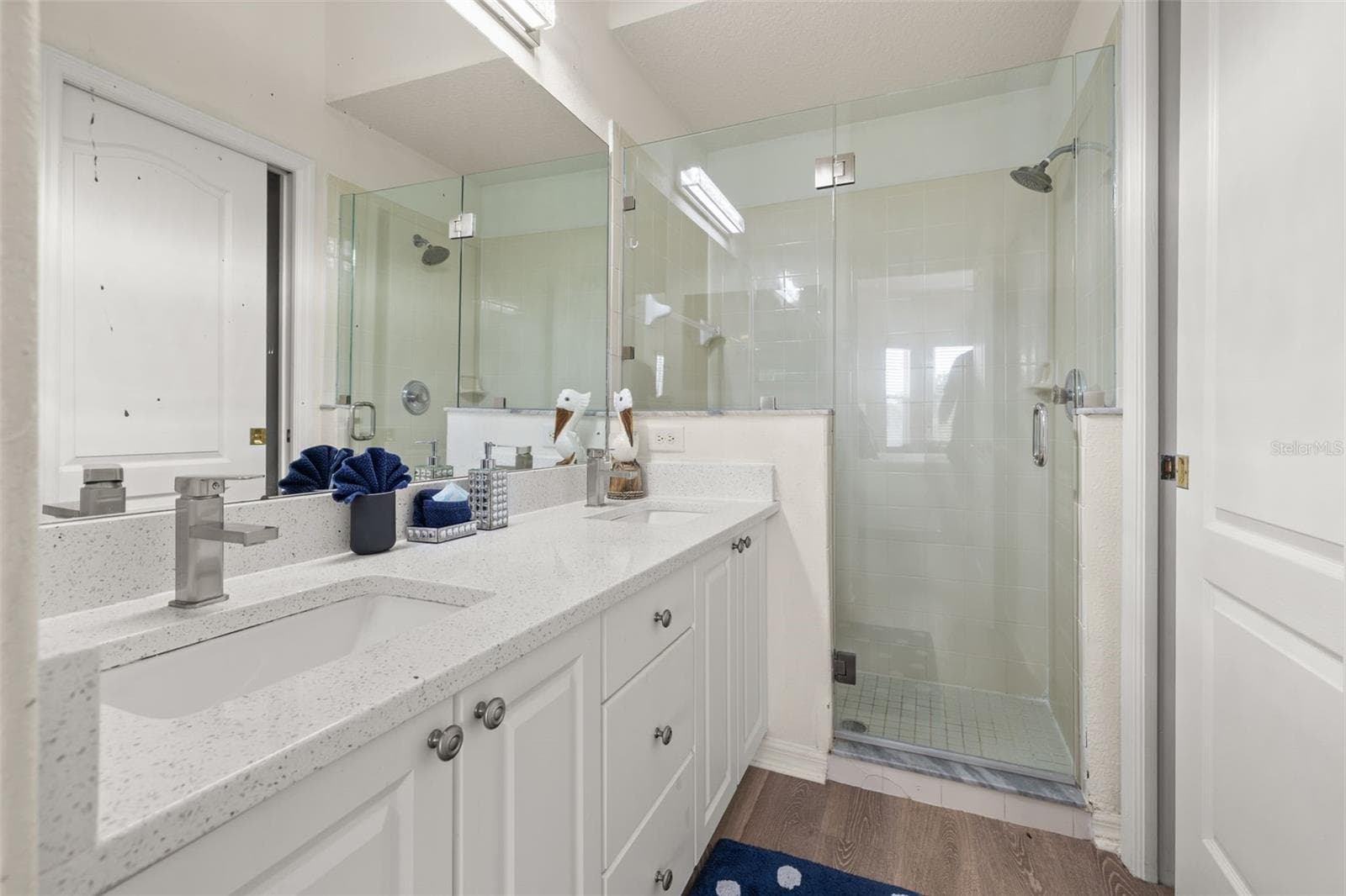 Primary bathroom with walk in shower and dual vanities - 506 BRUNELLO DR, DAVENPORT