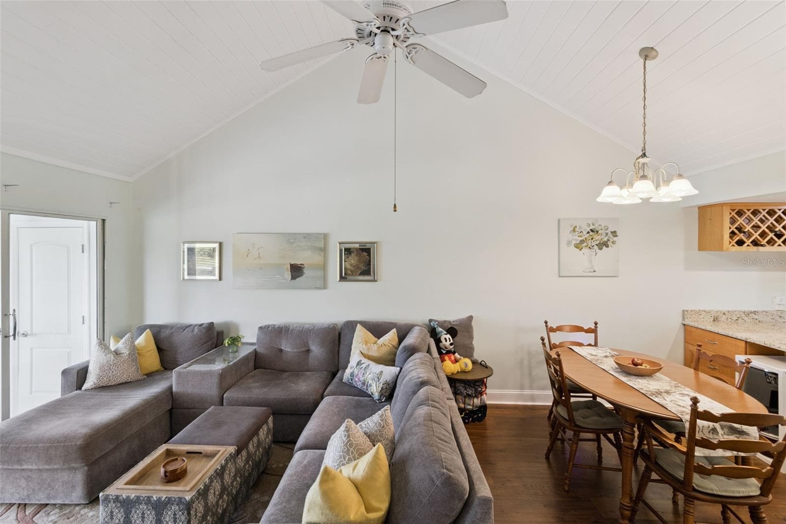 Tongue-in-groove cathedral ceiling with large fan feels like a resort lounge. - 1066 VILLA LN #63, APOPKA