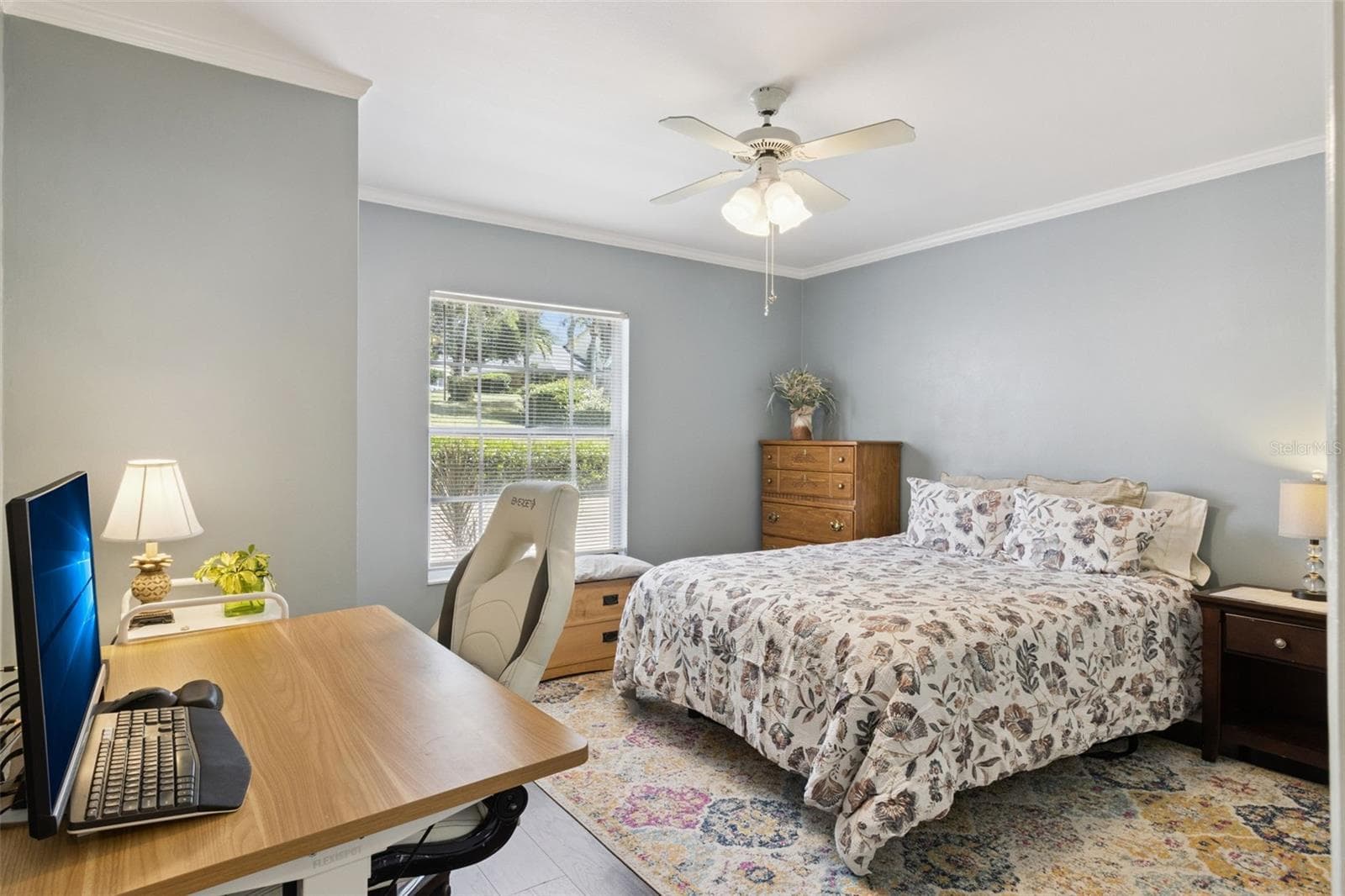 Secondary bedroom also has crown molding and ceiling fan with lights. - 1066 VILLA LN #63, APOPKA