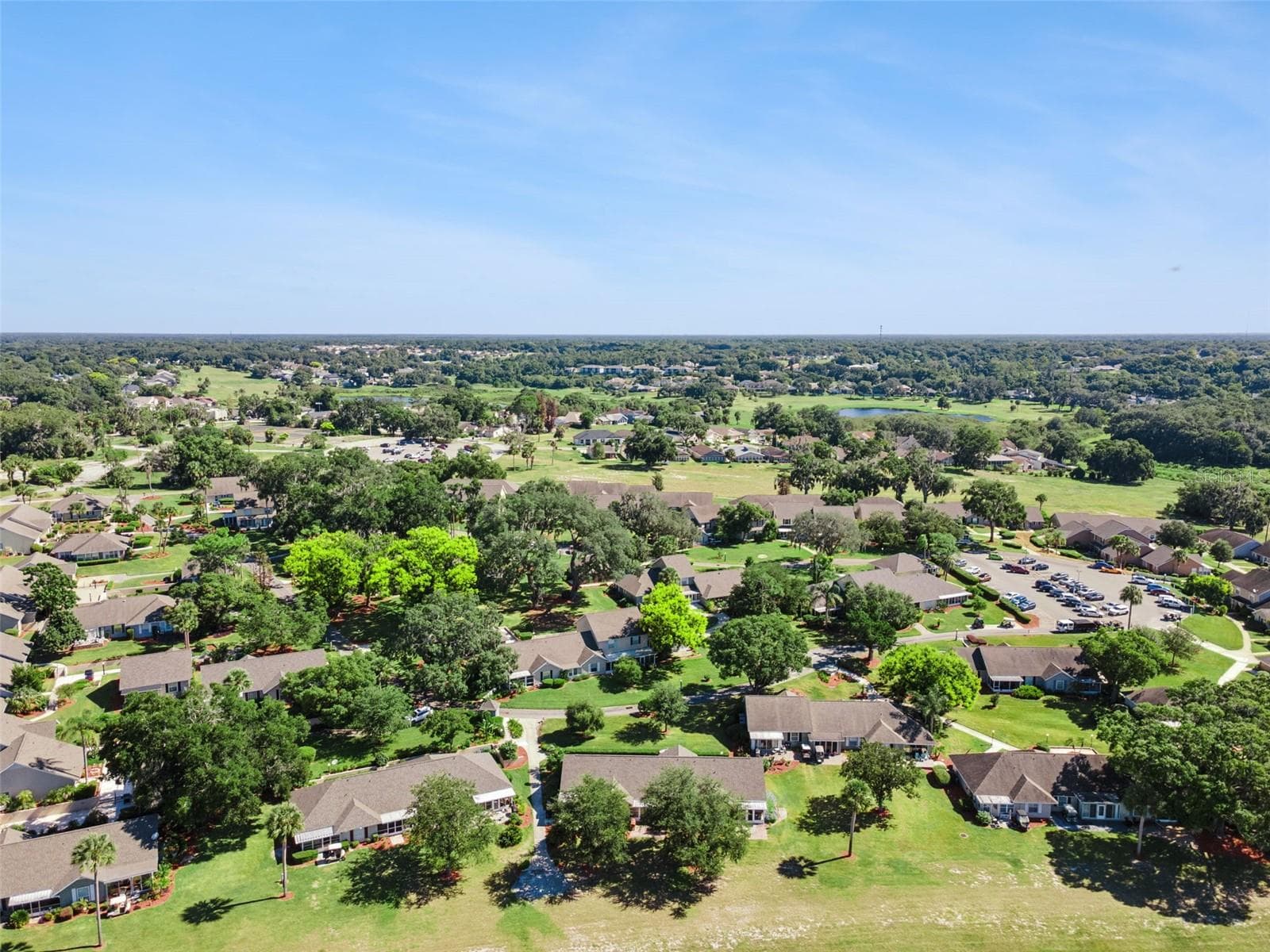 Golf carts are welcome to meander through the community's mature trees and gently rolling grounds. - 1066 VILLA LN #63, APOPKA