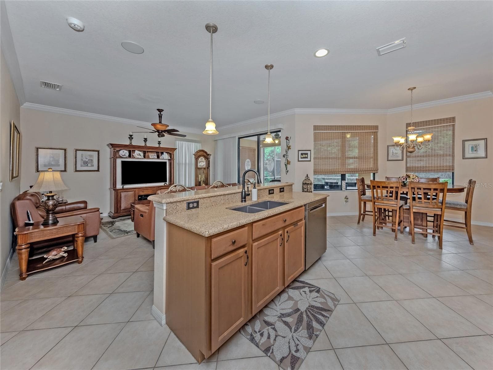 Kitchen with Granite Counter tops, dual sinks, looking over the family room, great room for entertaining - 20684 CAPELLO DR, VENICE