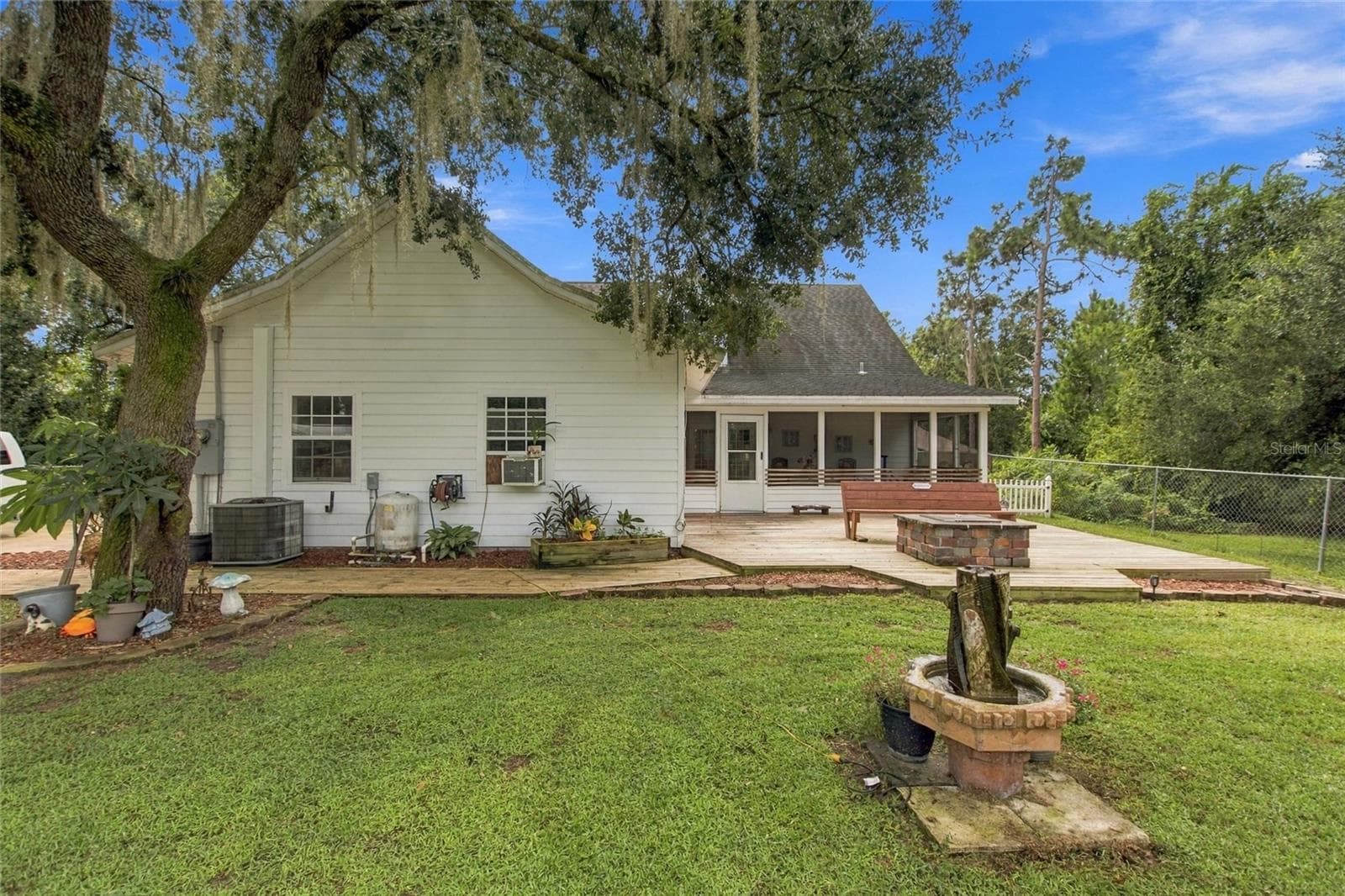 The two-car garage is on the rear of the home and has a side entry. - 3850 GRANADA DR, INDIAN LAKE ESTATES