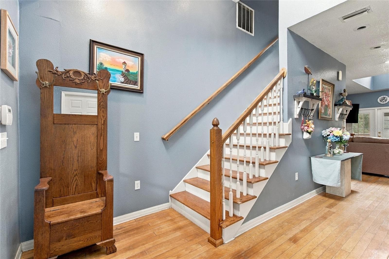 The foyer has stairs leading to the upstairs. - 3850 GRANADA DR, INDIAN LAKE ESTATES