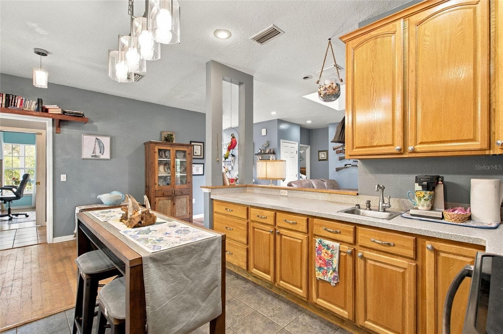 The kitchen has lots of cabinetry and counter space. There is also a prep sink. - 3850 GRANADA DR, INDIAN LAKE ESTATES