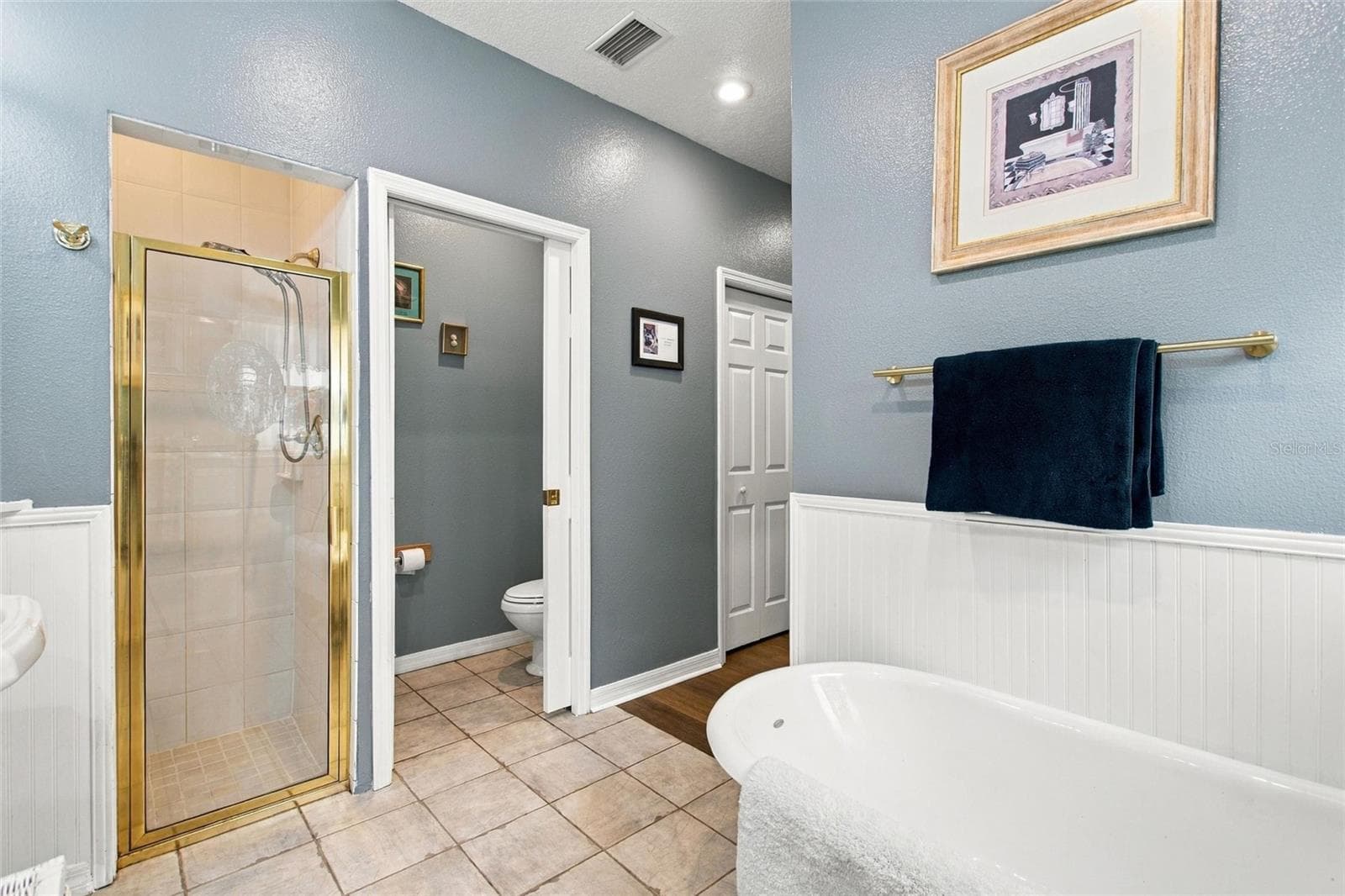 View of shower and water closet. - 3850 GRANADA DR, INDIAN LAKE ESTATES