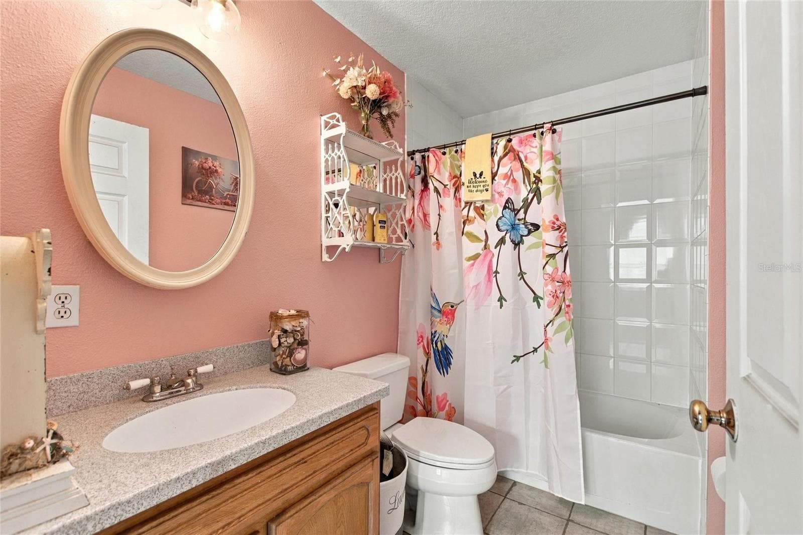 Upstairs bathroom that is between the two upstairs bedrooms. - 3850 GRANADA DR, INDIAN LAKE ESTATES