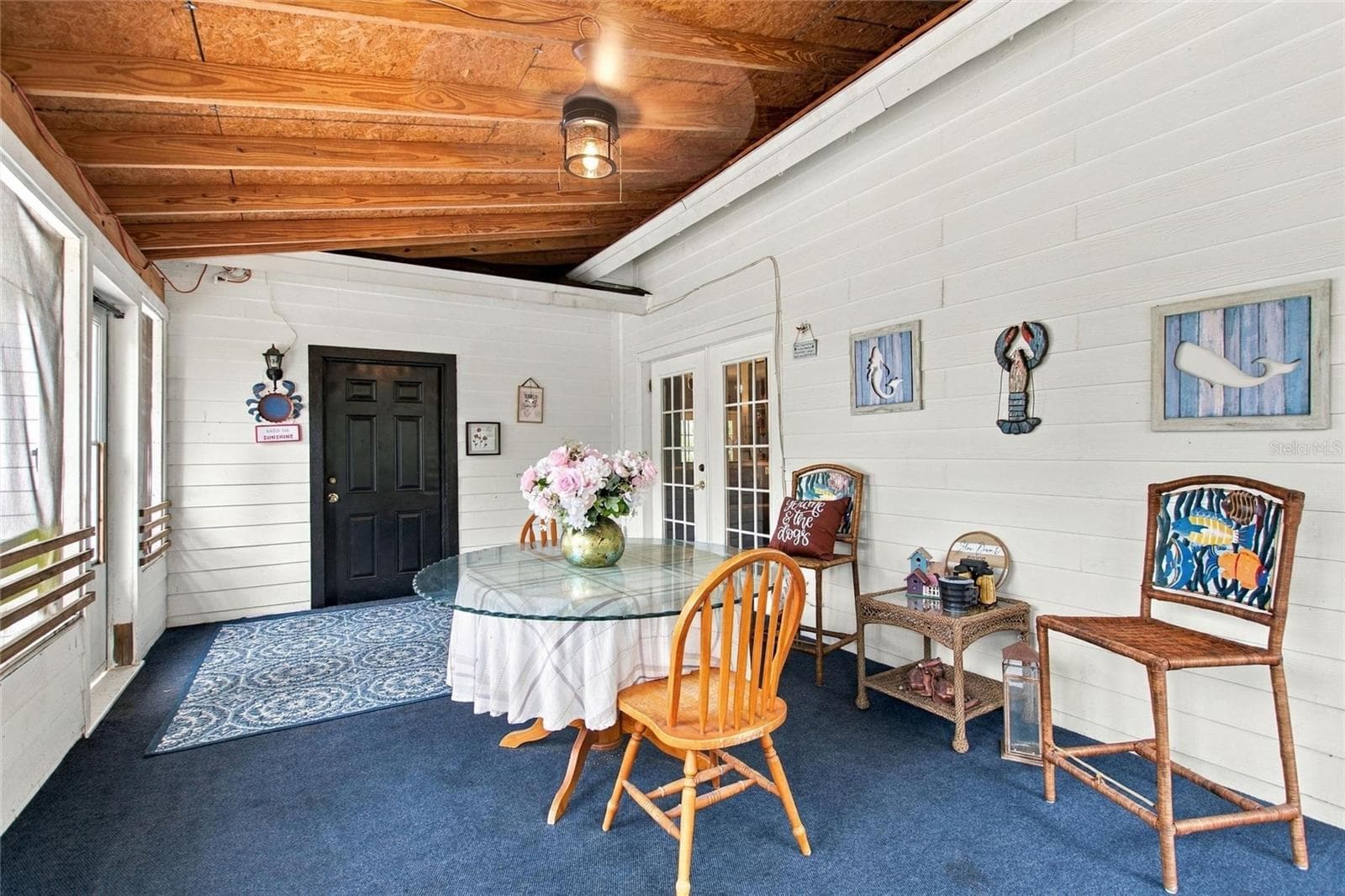 View of the patio area showing the entrance into the living room. - 3850 GRANADA DR, INDIAN LAKE ESTATES