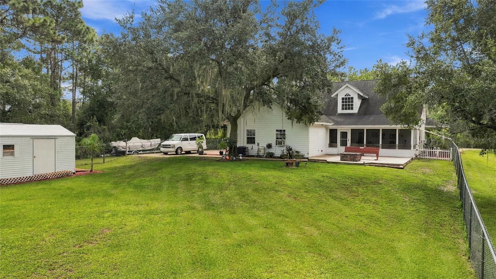 The back yard is fully fenced. Lots of area for the little ones and pets to safely play! - 3850 GRANADA DR, INDIAN LAKE ESTATES