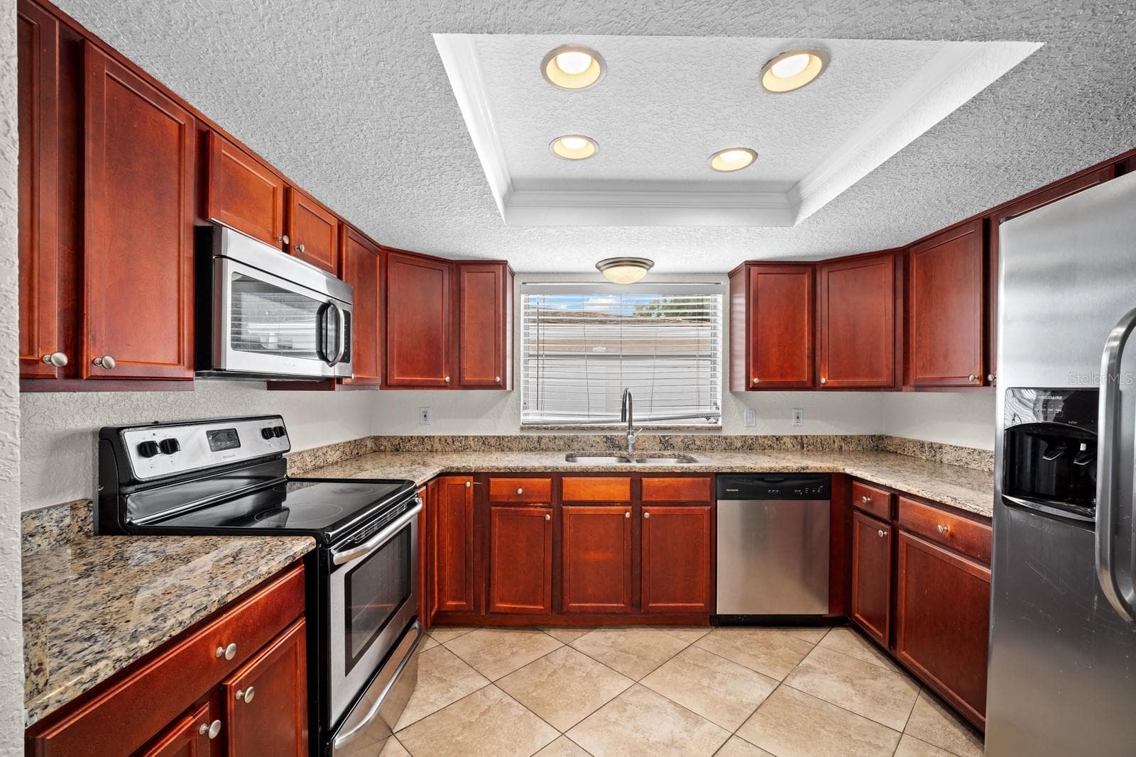 Plenty of Wood Cabinetry throughout - 7805 BURNHAM DR, PORT RICHEY