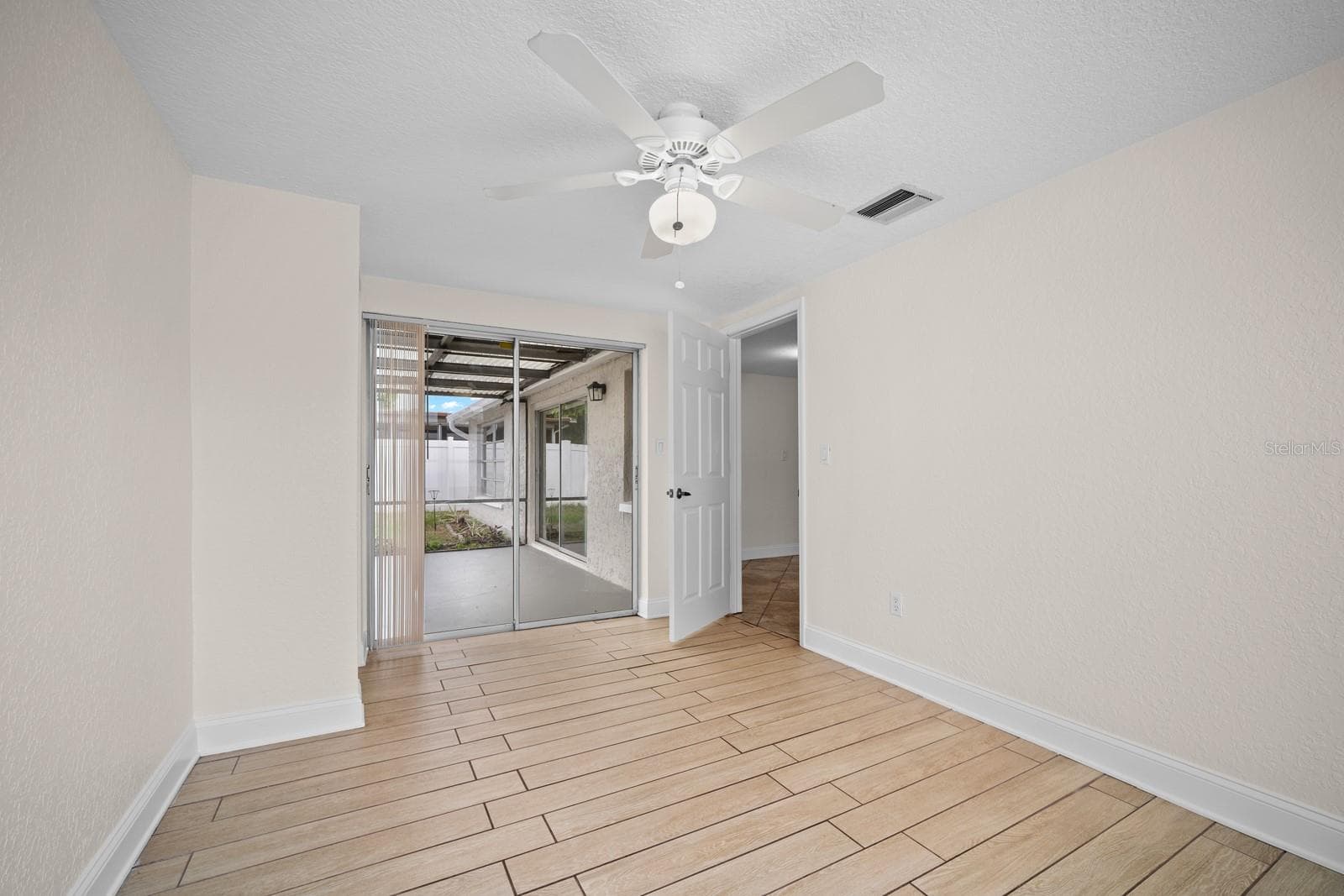 3rd Bedroom overlooking enclosed rear porch - 7805 BURNHAM DR, PORT RICHEY