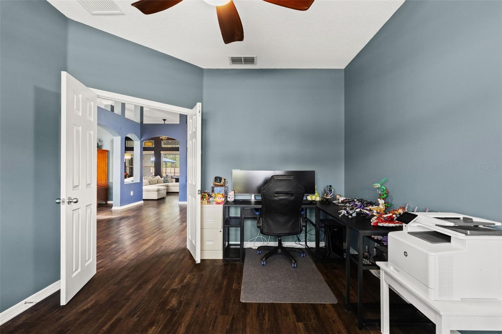 French doors allow the den to be closed off when needed—ideal for an office, study, hobby room, or quiet retreat. - 1419 BLUE MARLIN BLVD, HOLIDAY